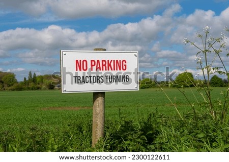 No Parking, tractors turning sign at the entrance to a field