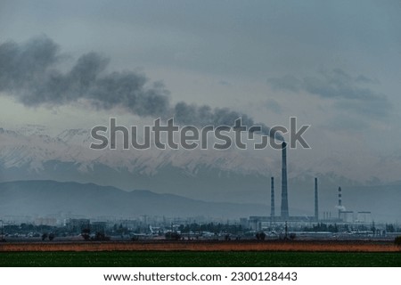 Coal power plant with smoke in Bishkek Kyrgyzstan Royalty-Free Stock Photo #2300128443