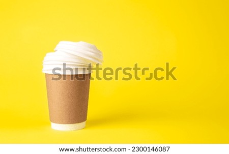 Paper cup and plastic lids on a yellow background isolated.