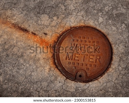 Detail of weathered rusted water meter cover texture