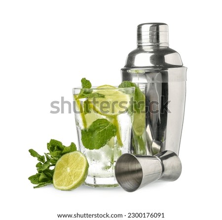 Shaker, measure cup and glass of tasty mojito on white background