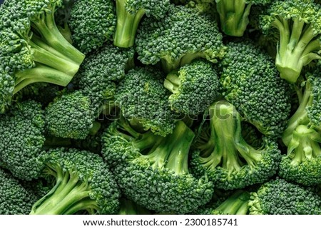 Macro photo green fresh vegetable broccoli. Fresh green broccoli on a black stone table.Broccoli vegetable is full of vitamin.Vegetables for diet and healthy eating.Organic food. Royalty-Free Stock Photo #2300185741