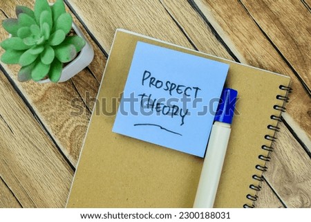 Concept of Prospect Theory write on sticky notes isolated on Wooden Table.