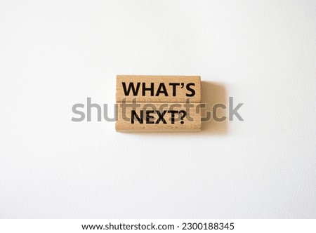 What is next symbol. Concept words What is next on wooden blocks. Beautiful white background. Business and What is next concept. Copy space.