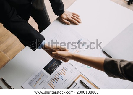 Business handshake for teamwork of business merger and acquisition,successful negotiate,hand shake,two businessman shake hand with partner to celebration partnership and business deal concept Royalty-Free Stock Photo #2300188803