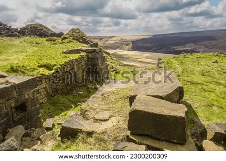 This Pule Hill circular walk is full of amazing rock formations, reservoirs and beautiful moorland. At just over 10km this walk only has a couple of steep climbs and is gentle for most of the way Royalty-Free Stock Photo #2300200309