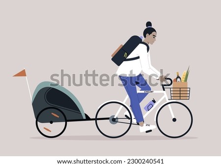 A young Asian parent riding a bike with a  kid trailer