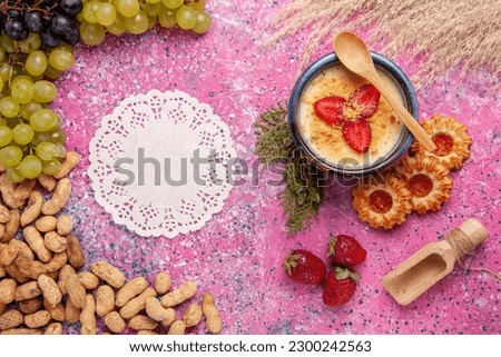 top view delicious creamy dessert with fresh green grapes cookies and peanuts on light-pink background dessert ice-cream berry cream sweet fruit
