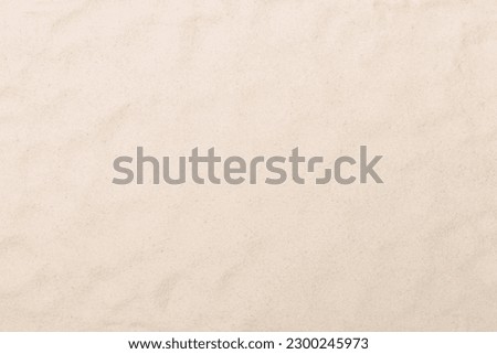 Sand on beach as background, top view Royalty-Free Stock Photo #2300245973