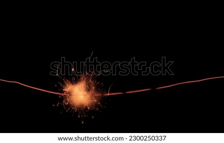 Sparkler trail of light with sparks in a straight line