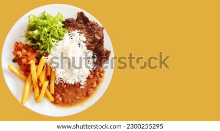 Traditional Brazilian meal named prato feito. Business, presentation with space to write text Royalty-Free Stock Photo #2300255295