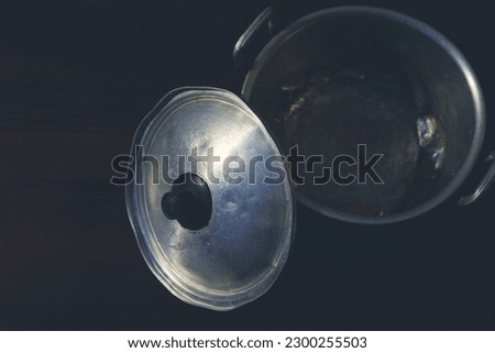 Aluminum pot with open lid utensil for cooking