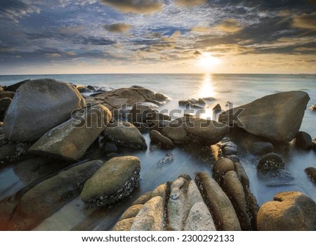 Long Exposure of Sunset at the sea,Larn hin khao , Rayong,Thailand , sunset at White rock beach , Rayong