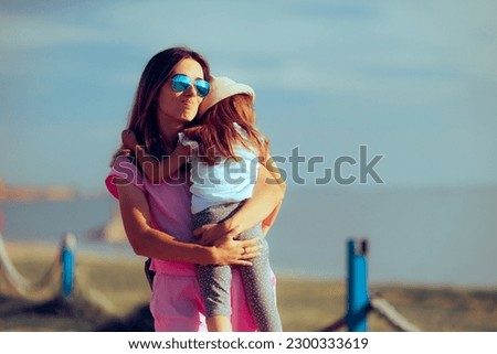 
Tired Mom Carrying her Exhausted Child in her Arms in Vacation. Stressful summer holiday with family feeling overwhelming  
 Royalty-Free Stock Photo #2300333619