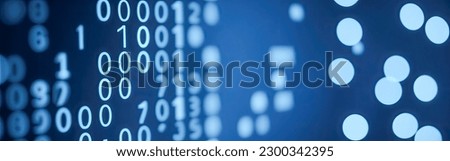 Blue digital binary data on computer screen with bokeh. Abstract information technology background. Digital binary code matrix background. Close-up with small dept Royalty-Free Stock Photo #2300342395