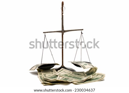 dollars on the scales on a white background