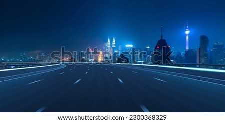 Highway overpass motion blur with city background . Royalty-Free Stock Photo #2300368329