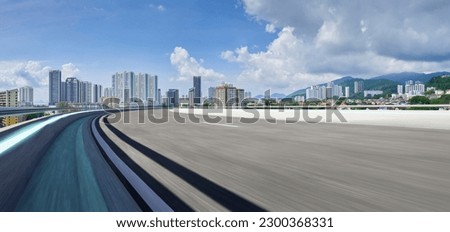 Highway overpass motion blur with city background . Royalty-Free Stock Photo #2300368331