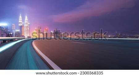 Highway overpass motion blur with city background . Royalty-Free Stock Photo #2300368335