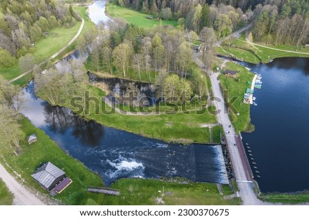 aerial view over dam lock sluice on lake impetuous waterfall Royalty-Free Stock Photo #2300370675