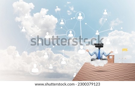 Faceless businessman with camera zoom instead of head sitting in lotus pose