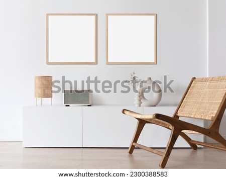 Two blank picture frame mockups on a wall. Square orientation. Artwork templates in interior design Royalty-Free Stock Photo #2300388583