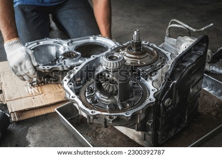 Differential and transfer case rebuilds and repairs ,automatic transmission repair and service in garage service shop. Royalty-Free Stock Photo #2300392787