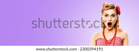 Unbelievable news! Excited surprised, very happy blondy hair woman. Pin up style girl wide open mouth, eyes. Retro and vintage studio ad concept. Isolated light purple violet color background.