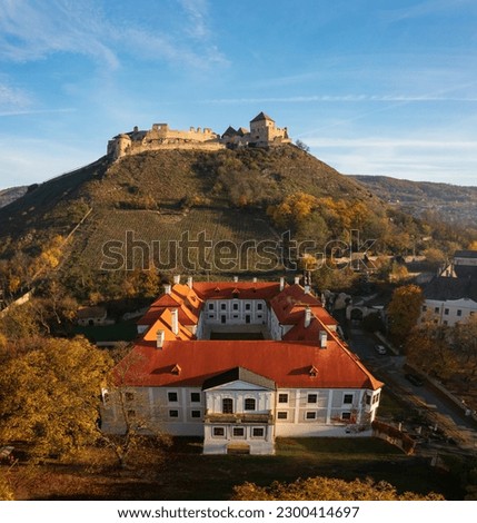 Panoramic view about castle of Sumeg and Bishop`s Palace with foggy sunrise at the background.