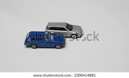 Miniature of touring cars on white background. Blue and silver