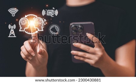 Woman using smartphone with social media icons on dark background. Technology concept