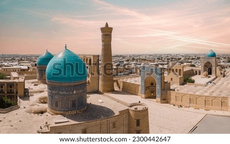 Bukhara, Uzbekistan Aerial view of Mir-i-Arab Madrasa Kalyan minaret. Translation on mosque: "Poi Kalyan Mosque" Royalty-Free Stock Photo #2300442647
