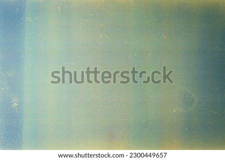 Abstract toned film texture background with grain, dust and light leak Royalty-Free Stock Photo #2300449657