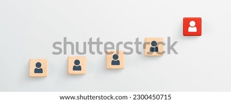 Leadership with person icon on wooden blocks. white background