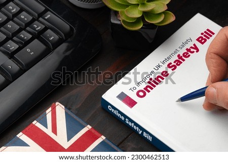 Online Safety Bill UK concept: man about to sign the new safety bill for the United Kingdom