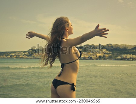 Girl feeling free at the beach