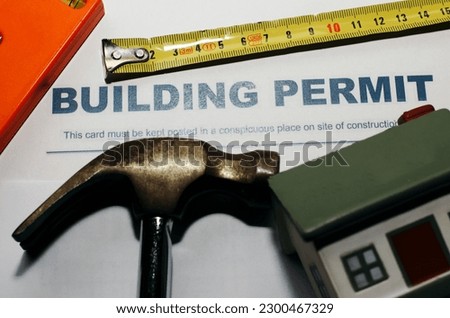 Building Permit concept with a residential home icon Royalty-Free Stock Photo #2300467329