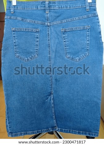 Picture of the back side of a denim skirt