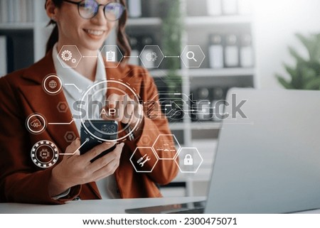 API Application Programming Interface, woman using laptop, tablet and smartphone with virtual screen API icon Software development tool, modern technology and networking concept.