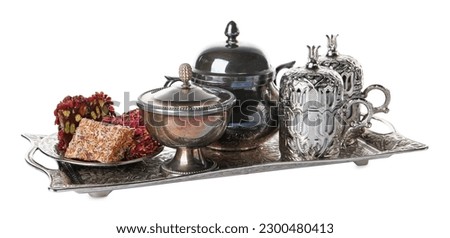 Tea and Turkish delight served in vintage tea set on white background