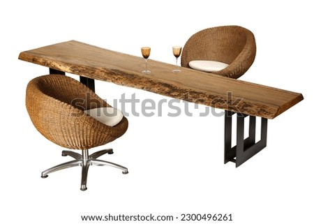 Wooden table with natural fiber chairs