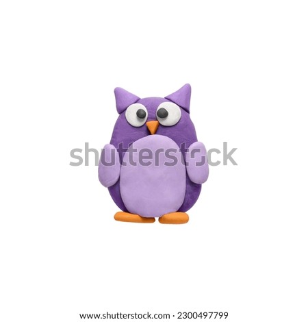Colorful plasticine owl isolated on white, top view