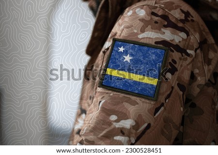 Curacao Soldier. Soldier with flag Curacao, Curacao flag on a military uniform. Camouflage clothing