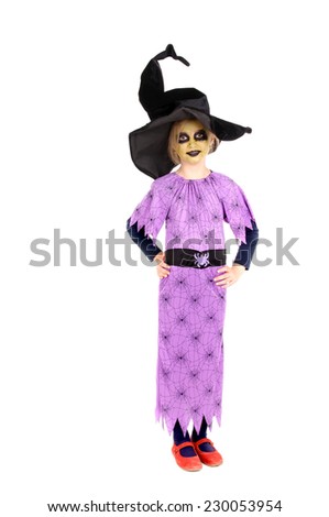 little girl dressed as a witch on halloween isolated