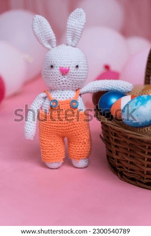 Easter egg hunt concept image, Easter rabbit with eggs