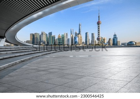 Empty square floor and city skyline with modern buildings in Shanghai, China.