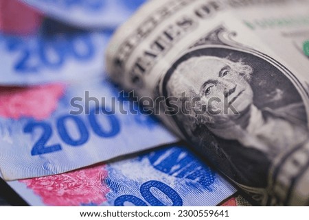 A one dollar bill from the United States with notes of money from Argentina.
 Royalty-Free Stock Photo #2300559641
