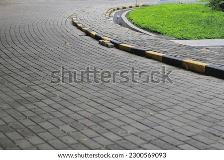 Abstract pattern of brick stone road with yellow and black color in the edge, seamless pattern photo illustration.
