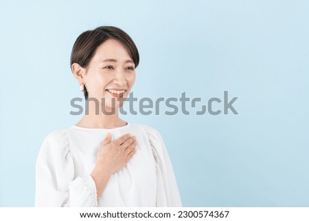 Smiling woman on blue background