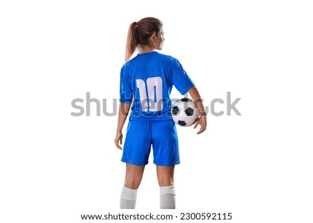  Portrait of young female soccer player standing with back with soccer ball standing on isolated Background. Royalty-Free Stock Photo #2300592115